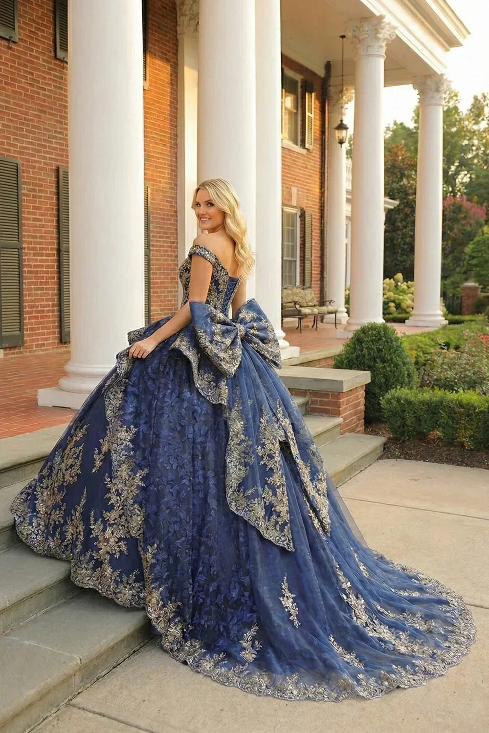 Carmina Layered Ruffled Ball Gown Cold Shoulder Quinceañera Dress With Floral Embroidery and Bow